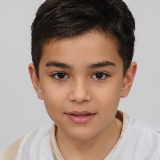 Joyful white child male with short  brown hair and brown eyes