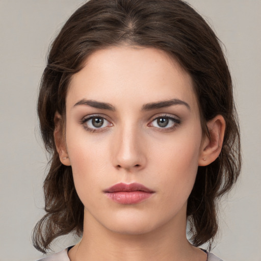 Neutral white young-adult female with medium  brown hair and brown eyes