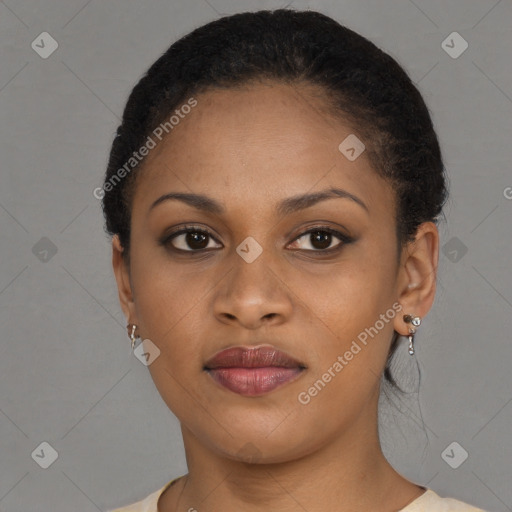 Joyful black young-adult female with short  brown hair and brown eyes