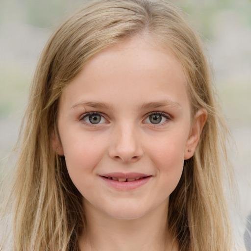 Joyful white child female with long  brown hair and blue eyes