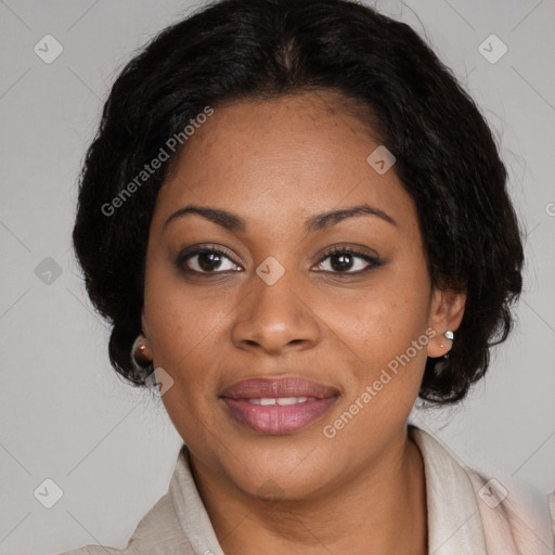Joyful black adult female with medium  brown hair and brown eyes