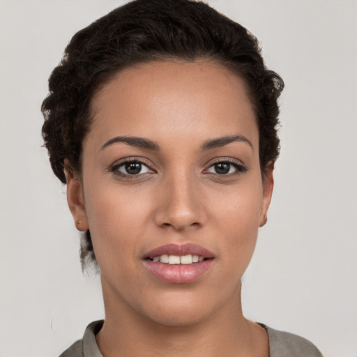 Joyful white young-adult female with short  brown hair and brown eyes