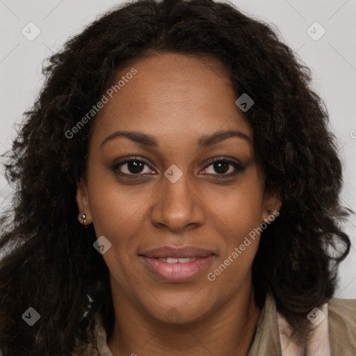 Joyful black young-adult female with long  brown hair and brown eyes