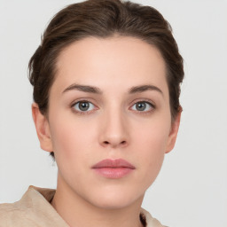 Neutral white young-adult female with short  brown hair and brown eyes