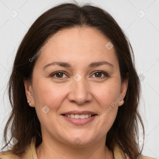 Joyful white adult female with long  brown hair and brown eyes