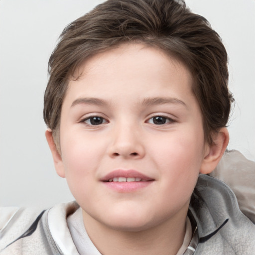 Joyful white child female with short  brown hair and brown eyes