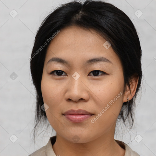 Joyful asian young-adult female with medium  black hair and brown eyes