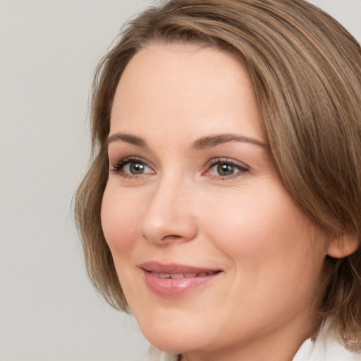 Joyful white young-adult female with medium  brown hair and brown eyes