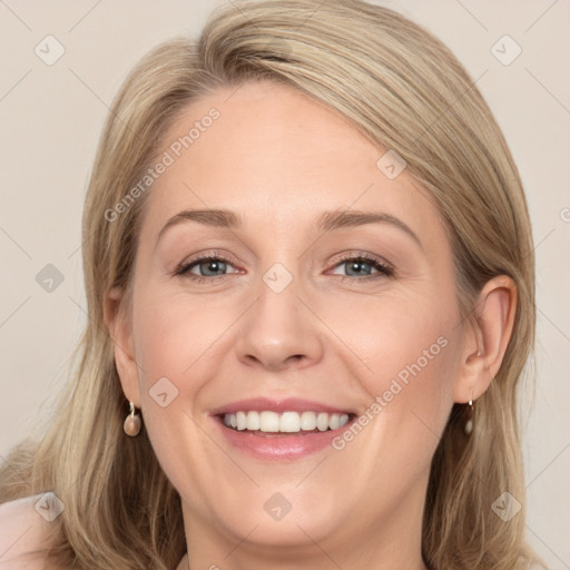 Joyful white young-adult female with long  brown hair and blue eyes