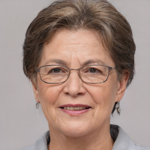 Joyful white middle-aged female with short  brown hair and grey eyes