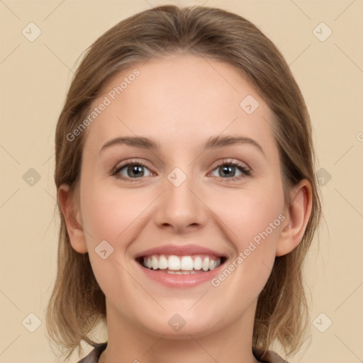 Joyful white young-adult female with medium  brown hair and green eyes