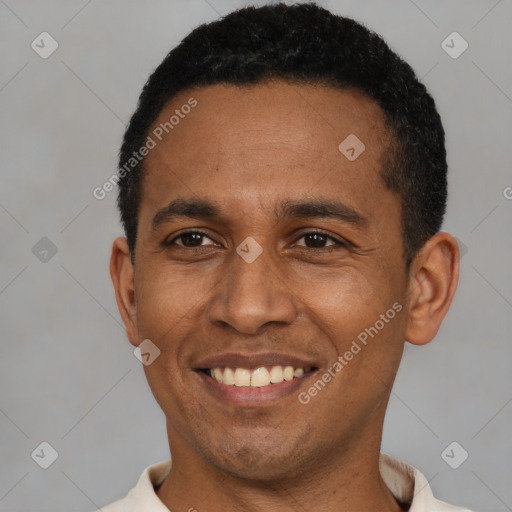 Joyful latino young-adult male with short  black hair and brown eyes