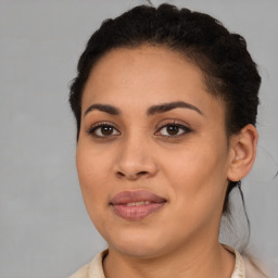 Joyful latino young-adult female with short  brown hair and brown eyes