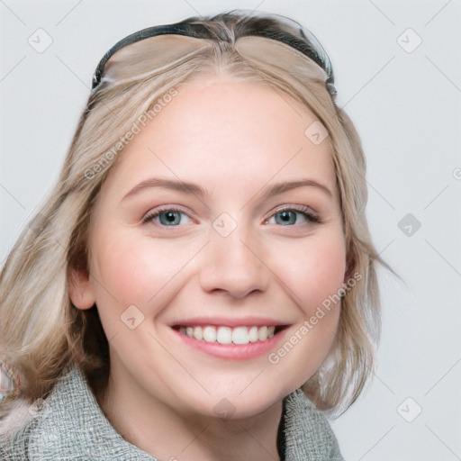 Joyful white young-adult female with medium  brown hair and blue eyes