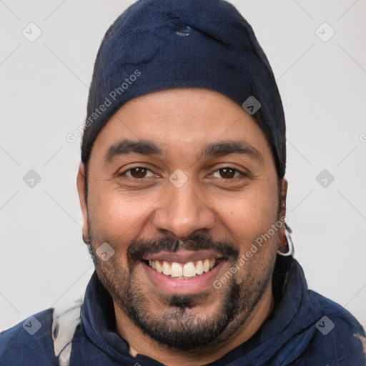 Joyful latino young-adult male with short  black hair and brown eyes