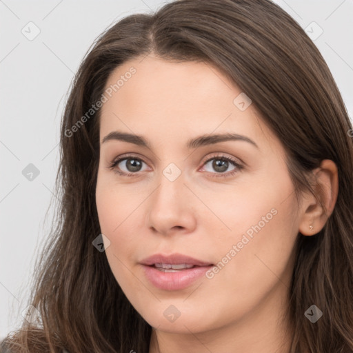 Neutral white young-adult female with long  brown hair and brown eyes