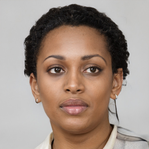Neutral black young-adult female with short  black hair and brown eyes
