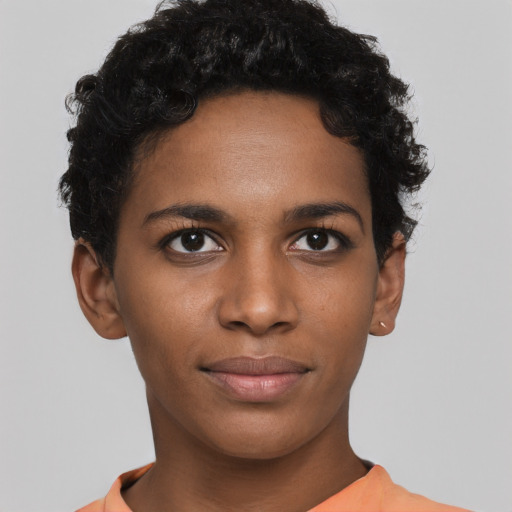 Joyful black young-adult female with short  brown hair and brown eyes