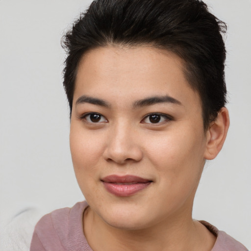 Joyful asian young-adult female with short  brown hair and brown eyes