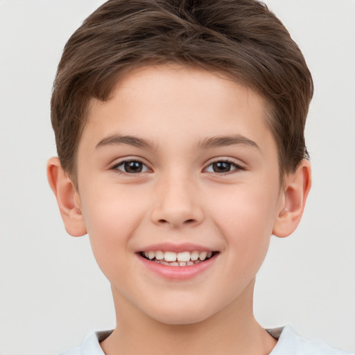 Joyful white child female with short  brown hair and brown eyes