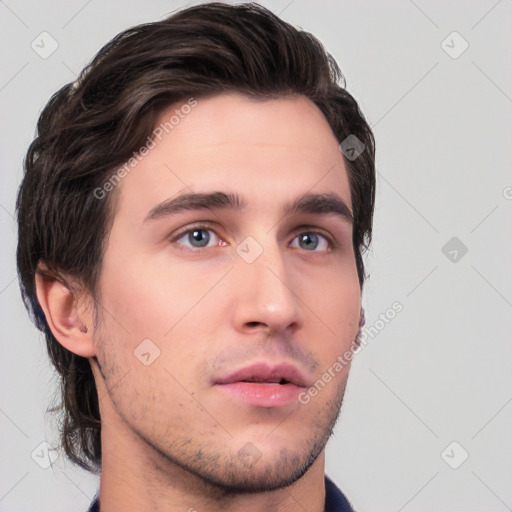 Neutral white young-adult male with short  brown hair and brown eyes