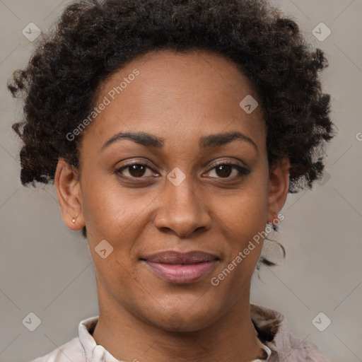 Joyful black adult female with short  brown hair and brown eyes