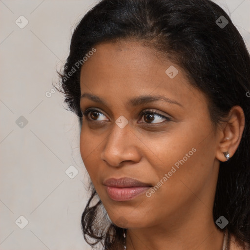 Joyful black young-adult female with medium  brown hair and brown eyes