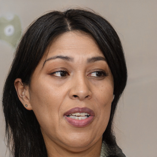 Joyful asian adult female with medium  brown hair and brown eyes