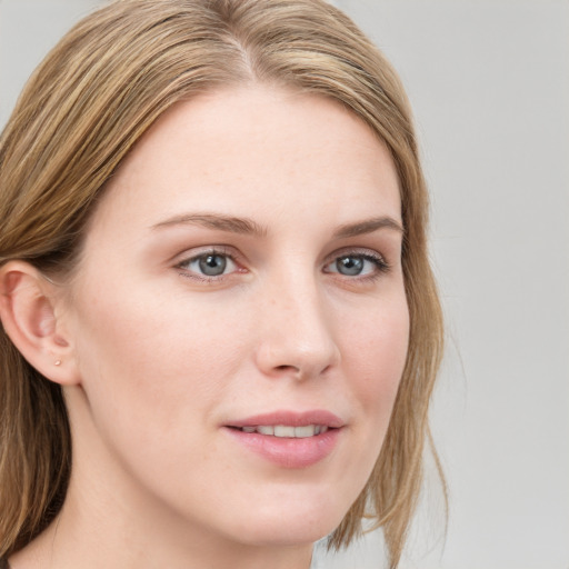 Joyful white young-adult female with medium  brown hair and blue eyes