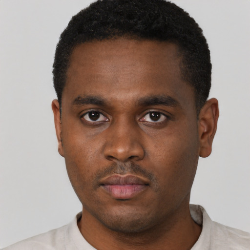 Neutral black young-adult male with short  black hair and brown eyes