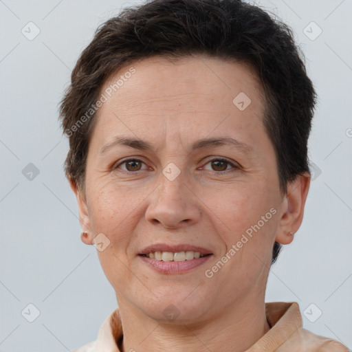 Joyful white adult female with short  brown hair and brown eyes