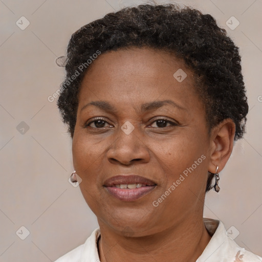 Joyful black adult female with short  brown hair and brown eyes