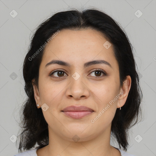 Joyful latino young-adult female with medium  brown hair and brown eyes