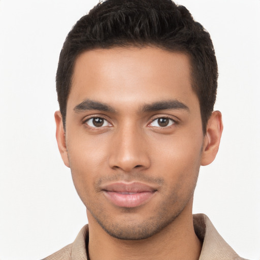 Joyful latino young-adult male with short  brown hair and brown eyes