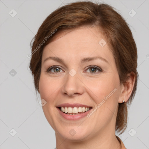 Joyful white young-adult female with medium  brown hair and green eyes