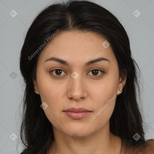 Joyful latino young-adult female with long  brown hair and brown eyes