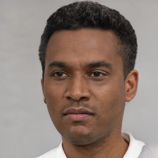 Neutral black young-adult male with short  black hair and brown eyes