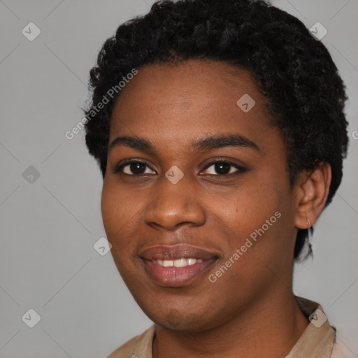 Joyful black young-adult female with short  black hair and brown eyes