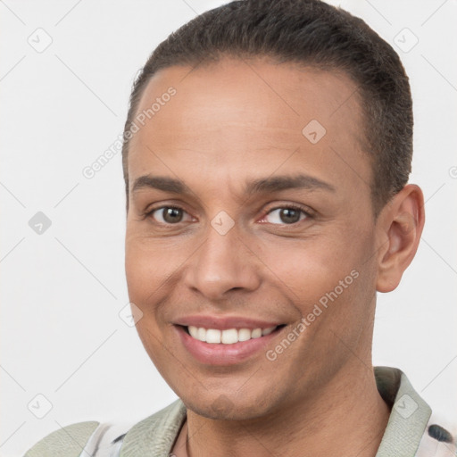 Joyful white young-adult male with short  brown hair and brown eyes