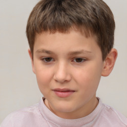 Joyful white child male with short  brown hair and brown eyes