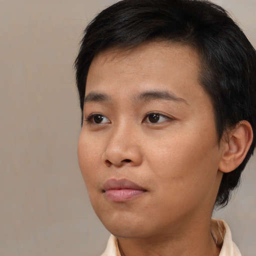 Neutral black young-adult female with medium  black hair and brown eyes