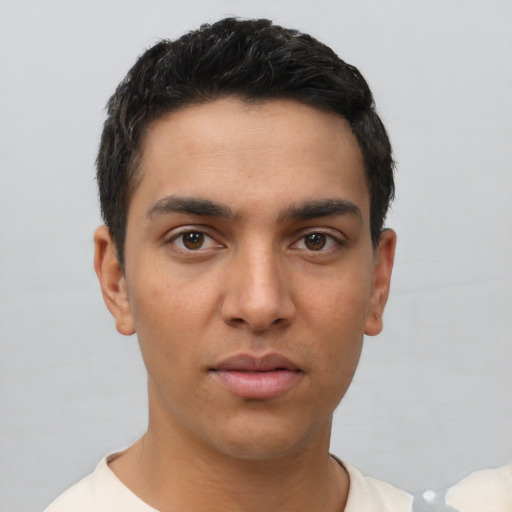 Neutral latino young-adult male with short  black hair and brown eyes