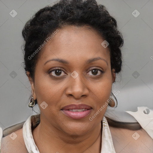 Joyful black adult female with short  brown hair and brown eyes