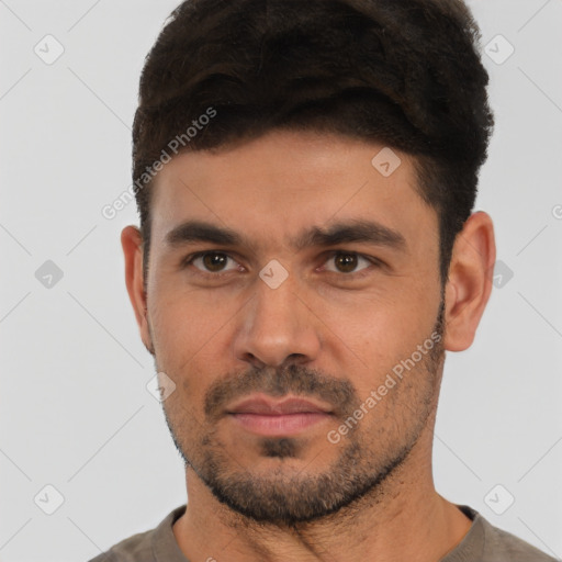 Neutral white young-adult male with short  black hair and brown eyes