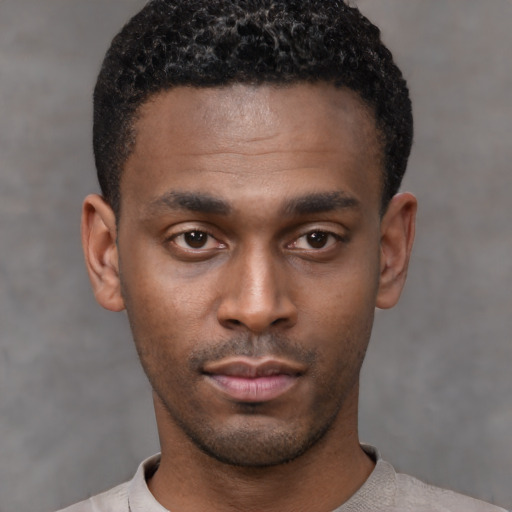 Neutral black young-adult male with short  black hair and brown eyes