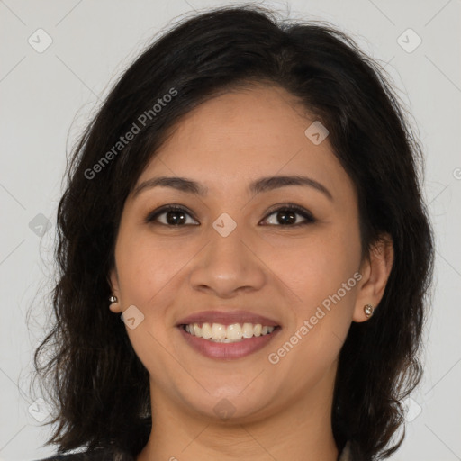 Joyful latino young-adult female with long  brown hair and brown eyes