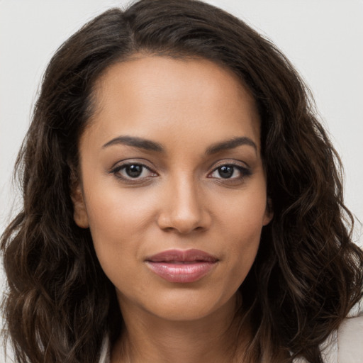 Joyful white young-adult female with long  brown hair and brown eyes