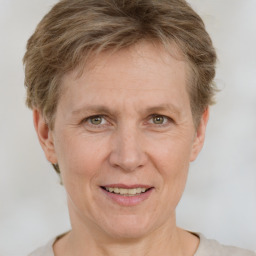 Joyful white adult female with short  brown hair and grey eyes