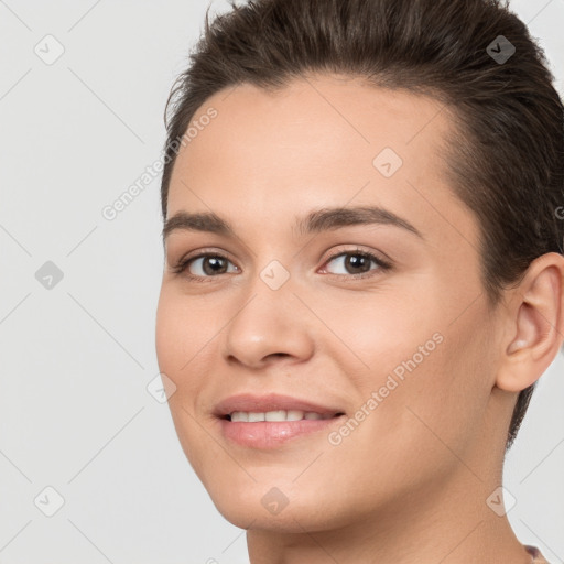 Joyful white young-adult female with short  brown hair and brown eyes