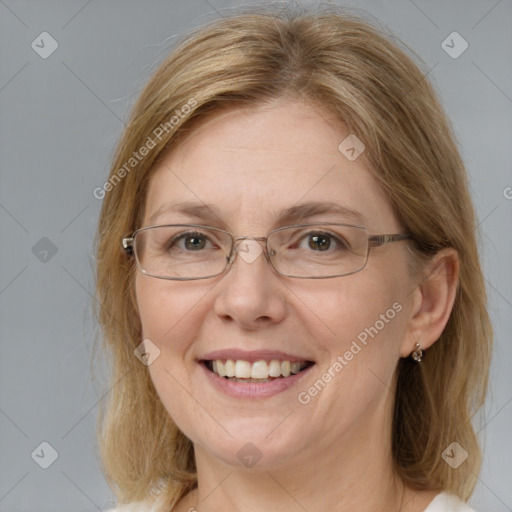 Joyful white adult female with medium  brown hair and blue eyes